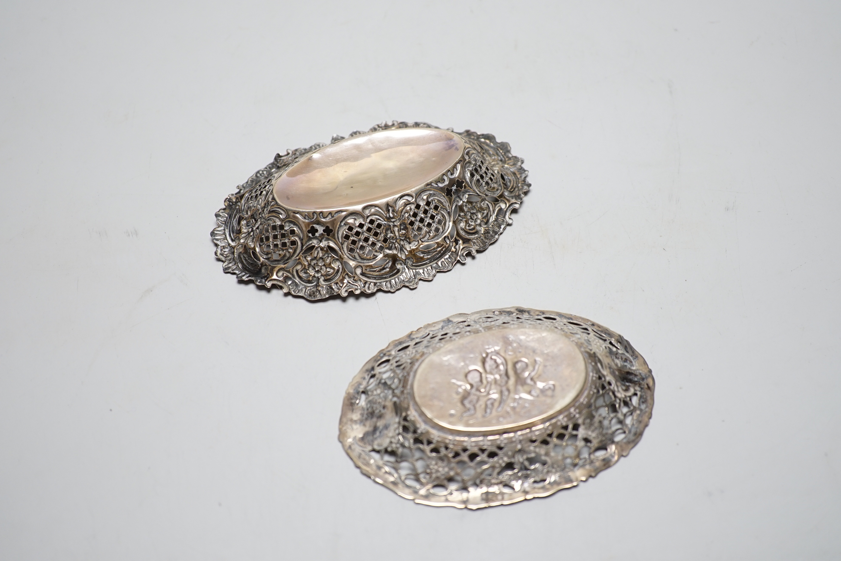Two small oval pieced silver bonbon dishes, Birmingham, 1898, 13cm and smaller German 800 standard.